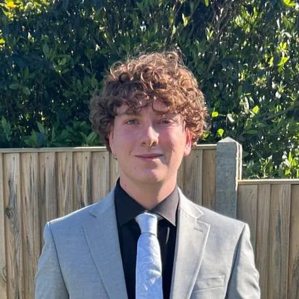 Portrait of Mitchel Burford, Consumer & Retail Analyst